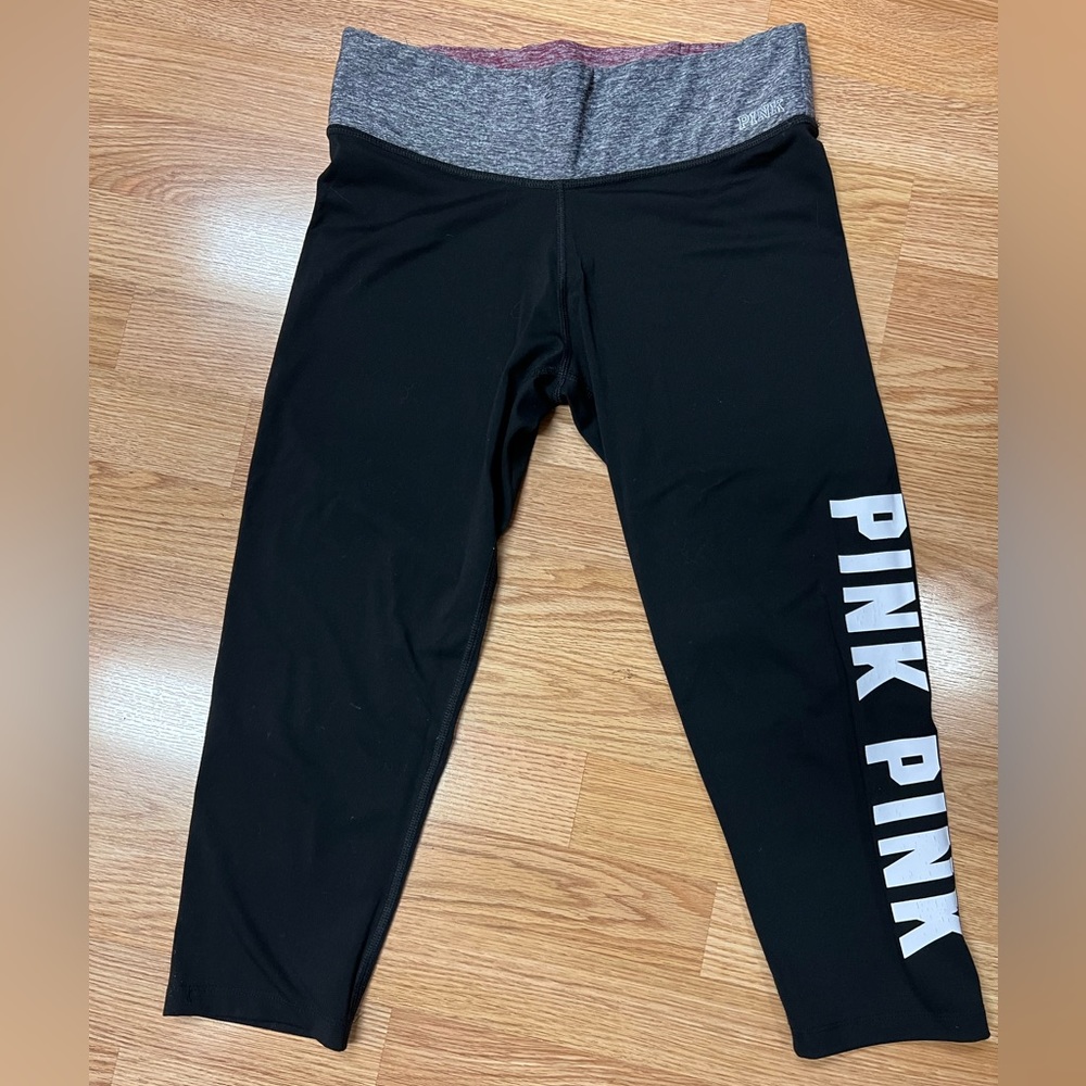 Small Reversible Pink crop leggings black with PINK logo in white one side.